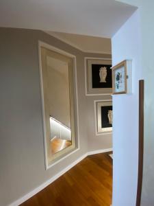 an empty room with a mirror and a window at b&b by family L&G in Vibo Valentia Marina