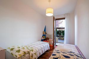 a bedroom with a bed and a large window at Martilla in Gabicce Mare