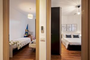 a bedroom with two beds and a room with two beds at Martilla in Gabicce Mare