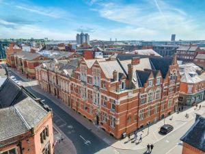 an aerial view of a city with buildings at The Pocklington - The Golden Mile Suite in Leicester