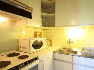 Kuchyň nebo kuchyňský kout v ubytování Mont-Dore T2 avec Balcon et Garage Privé - FR-1-608-133 + 5 fotografií