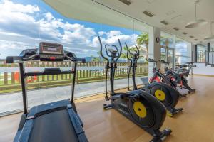 a gym with a row of exercise bikes in front of a window at Penthouse with private pool in La Cala de Mijas