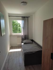 Postel nebo postele na pokoji v ubytování Gästewohnung in Hohenstein-Ernstthal