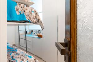 a bedroom with a bunk bed and a mirror at LA MANDORLA Luxury Rooms in Caltabellotta