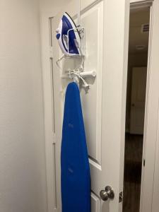 a blue object is hanging on a door at Brand New Cute Home in Odessa near Midland in Odessa