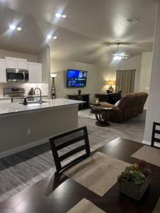 a large living room with a kitchen and a living room at Brand New Cute Home in Odessa near Midland in Odessa