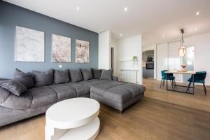 a living room with a couch and a table at Apartments Luna in Dramalj