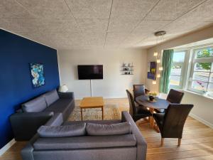 a living room with a couch and a table at City Breakaway in Sønderborg