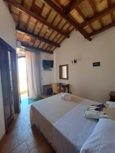 Postel nebo postele na pokoji v ubytování HOTEL Cala Buguto
