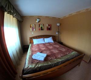 Postel nebo postele na pokoji v ubytování Riverside Motel Jelgava