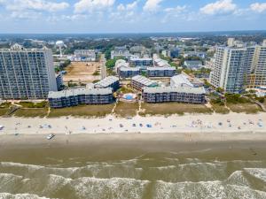 an aerial view of a beach and buildings at Sweet Caroline Remodeled with Partial Ocean View and Oceanfront Pool in Myrtle Beach