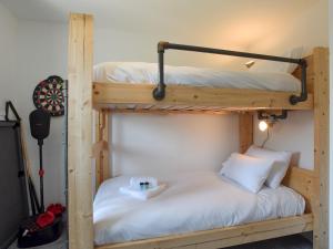 a bedroom with two bunk beds in a room at Pass the Keys Beautiful Family Home Sleeps 6 in Emsworth