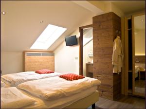 Rúm í herbergi á Hotel Pangrazzi - 3 stelle superior