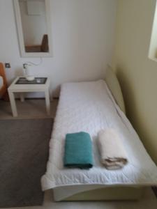 Postel nebo postele na pokoji v ubytování Apartman Bukulja