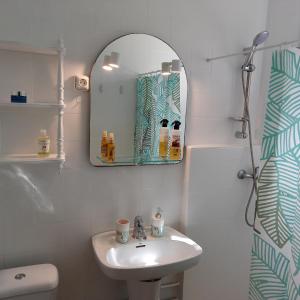 a bathroom with a sink and a mirror at Casa in Calpe Carrio Park in Calpe
