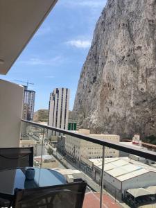 a view of a mountain from the balcony of a building at CP luxury studio in Gibraltar