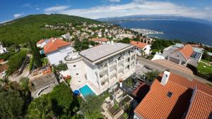 an aerial view of a building in a city at Villa Sunny Ičići- Apartment Sun in Ičići