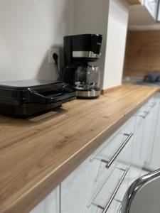 a black toaster sitting on top of a kitchen counter at Studio Coral by the sea in Neoi Epivates