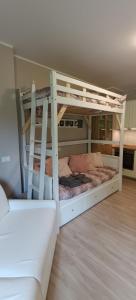a bedroom with two bunk beds in a room at Casa Natura in Castione della Presolana