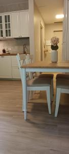 a table and chairs in a kitchen with a table and a table and chairsktop at Casa Natura in Castione della Presolana
