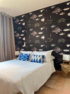 Ένα ή περισσότερα κρεβάτια σε δωμάτιο στο Hotel Princesse D'Azur
