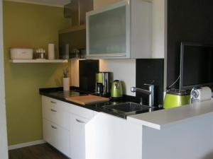 Кухня или мини-кухня в Eldorado - Ferienwohnungen & Suiten
