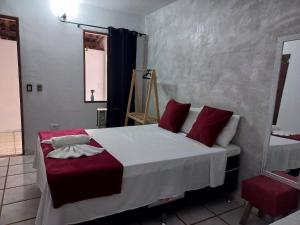 Postel nebo postele na pokoji v ubytování Villa dos Pássaros Paraty Hospedagem