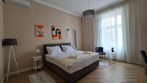 Postel nebo postele na pokoji v ubytování Urban Haven
