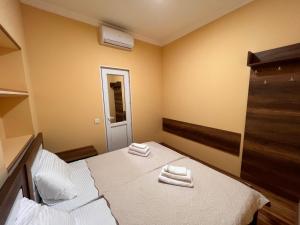 Postel nebo postele na pokoji v ubytování Hotel BANI