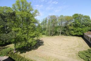 an aerial view of a large yard with trees at Schloß Wichmannsdorf in Kröpelin