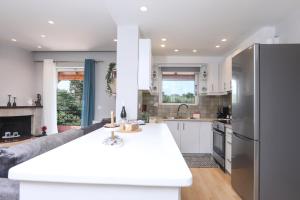 a kitchen with a large white counter top in a room at Casa Aphrodite in Kanálion
