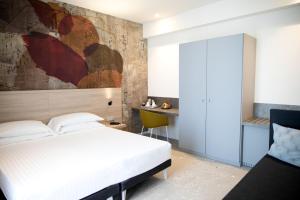 Postel nebo postele na pokoji v ubytování Hotel Cristallo