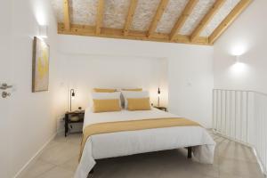 Postel nebo postele na pokoji v ubytování Madalena Village 1 - City centre by HD PROPERTIES