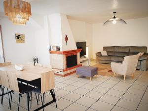 a living room with a table and a fireplace at RESIDENCIA TORTUGA MORA in Calabardina