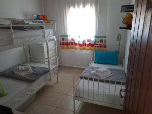 Postel nebo postele na pokoji v ubytování Seaside Villa Hatzi