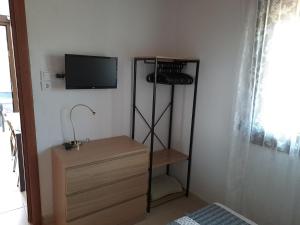 TV a/nebo společenská místnost v ubytování Seaside Villa Hatzi