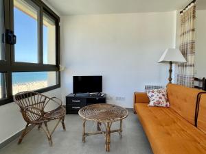 A television and/or entertainment centre at CAP CASTELL 8-A