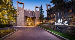 a driveway in front of a building at night at Timberline Condominiums 1 Bedroom Standard C2C in Snowmass Village
