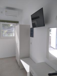 A television and/or entertainment centre at Oasis