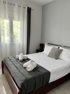 Postel nebo postele na pokoji v ubytování Korithis Apartment