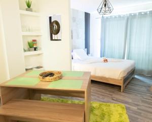 Postel nebo postele na pokoji v ubytování Ti Zion - Studio-Près de la plage By Sister Home