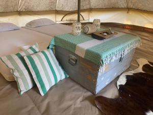 a bed with two mats on top of it at Tiny house & Glamping tent in Kotor