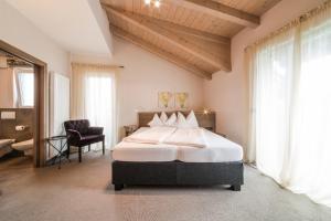 Posteľ alebo postele v izbe v ubytovaní Boutiquehotel Minigolf