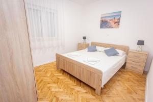 Ένα ή περισσότερα κρεβάτια σε δωμάτιο στο Apartments Veronika