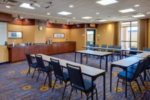 a waiting room with tables and chairs and a cash register at Courtyard by Marriott Oklahoma City North/Quail Springs in The Village
