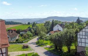 a village with a road and houses and trees at 1 Bedroom Beautiful Apartment In Morschen in Morschen