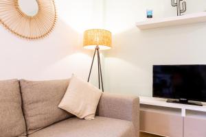 Televízia a/alebo spoločenská miestnosť v ubytovaní Teatro Suites Málaga CITY FLAT