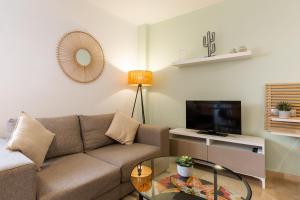Televízia a/alebo spoločenská miestnosť v ubytovaní Teatro Suites Málaga CITY FLAT