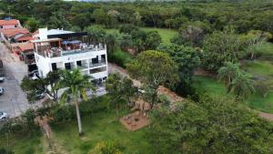 an aerial view of a building with a palm tree at Pousada solar do Cerrado in Rifaina