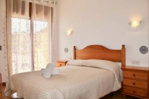 Postel nebo postele na pokoji v ubytování Apartaments Les Dunes